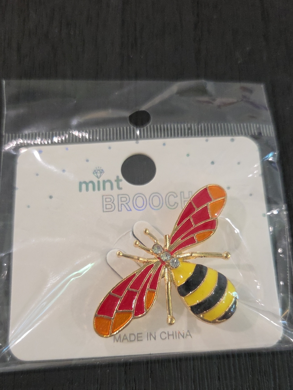 Mint Enamel Bee Brooch in Red, Orange, Yellow & Black
